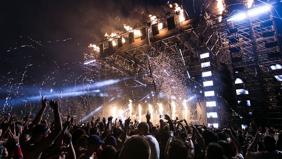 Concert stage lights illuminating a performance — EXO's Xiumin announces second solo album Interview X releasing March 10, 2025 through INB100