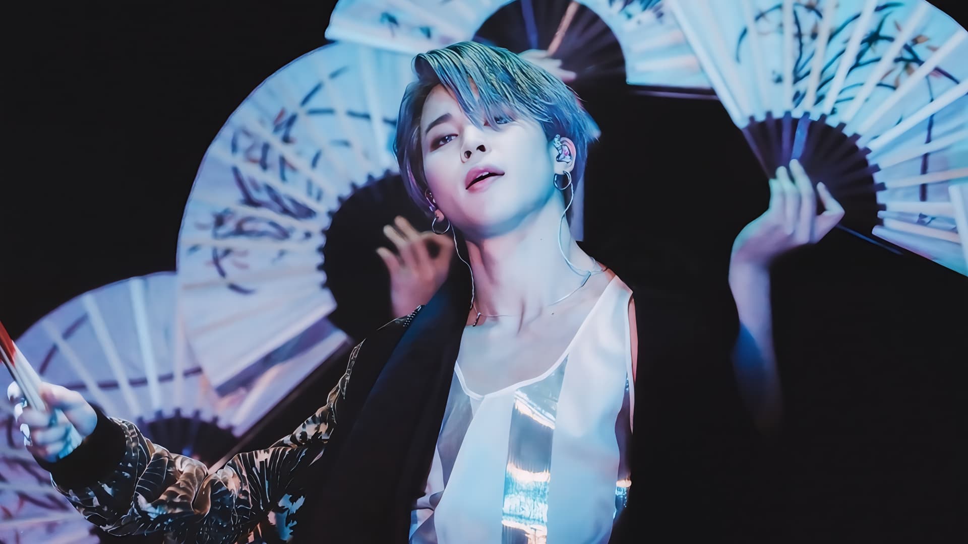 BTS Jimin performing with traditional Korean fans in a captivating stage moment