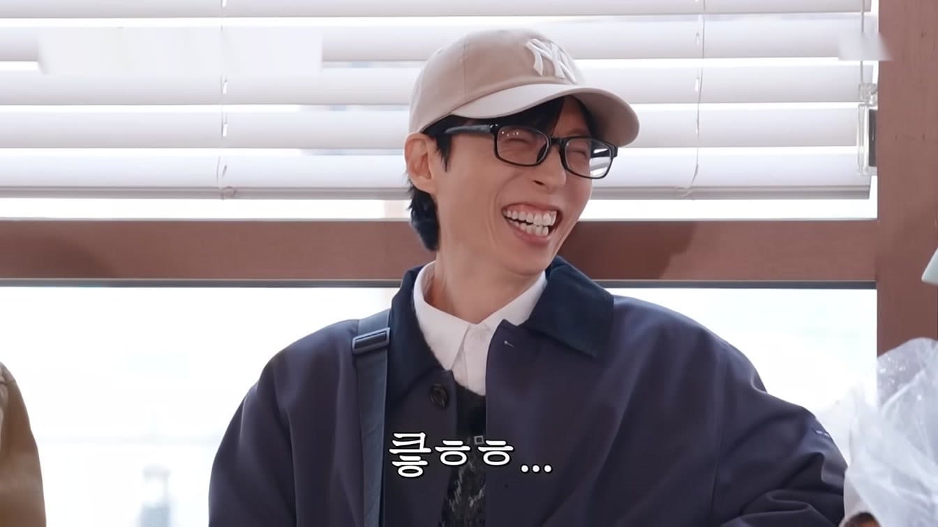 Yoo Jae-suk in a promotional portrait used for an analysis of his cross-platform variety influence.