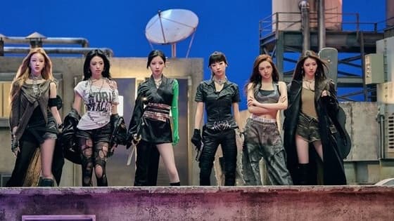 BABYMONSTER in a rooftop group shot from the 'WE GO UP' MV filming set, October 2025
