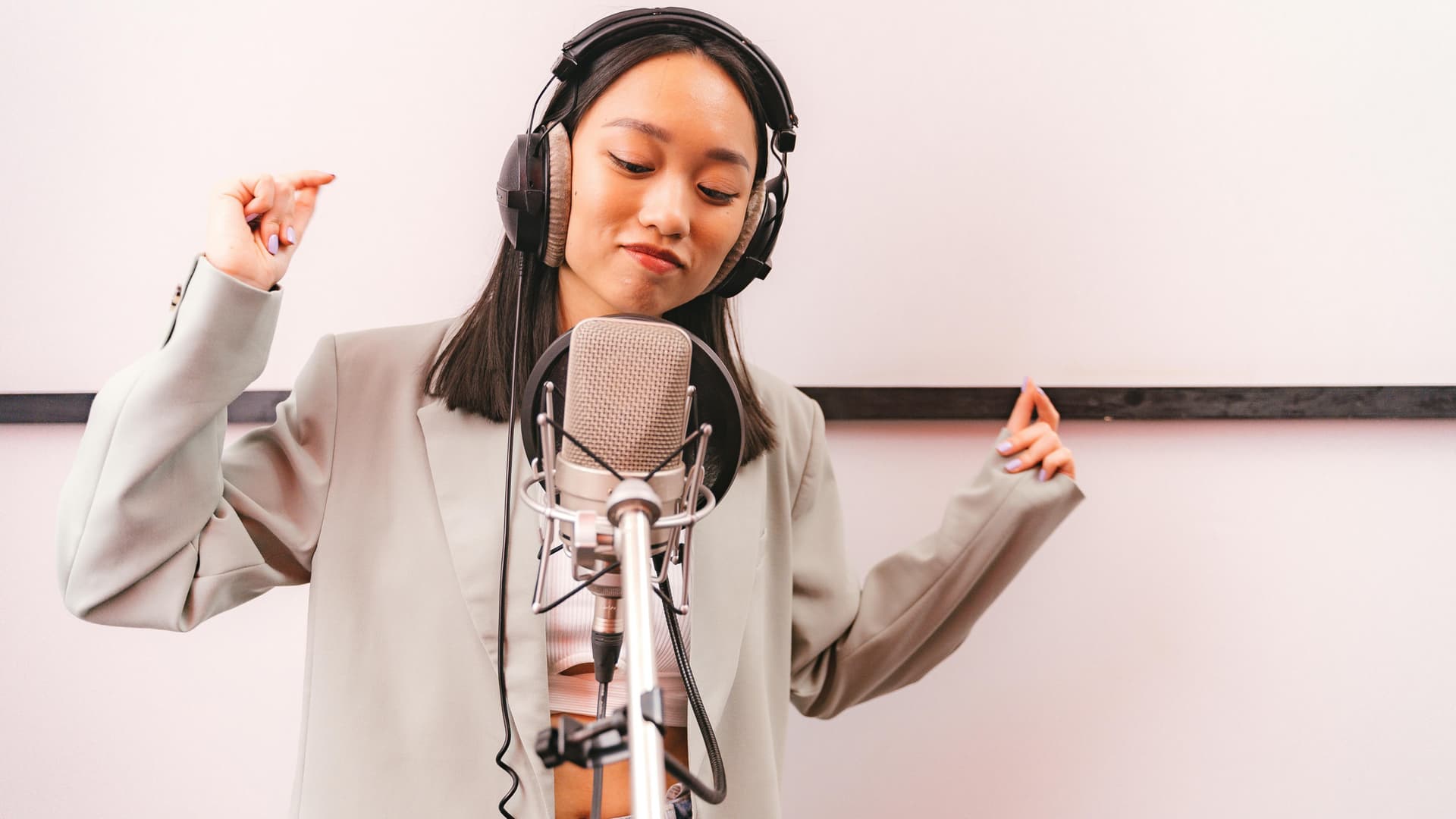 A female recording artist performing in a studio — illustrating Nam Gyuri's return to music with her chart-topping remake