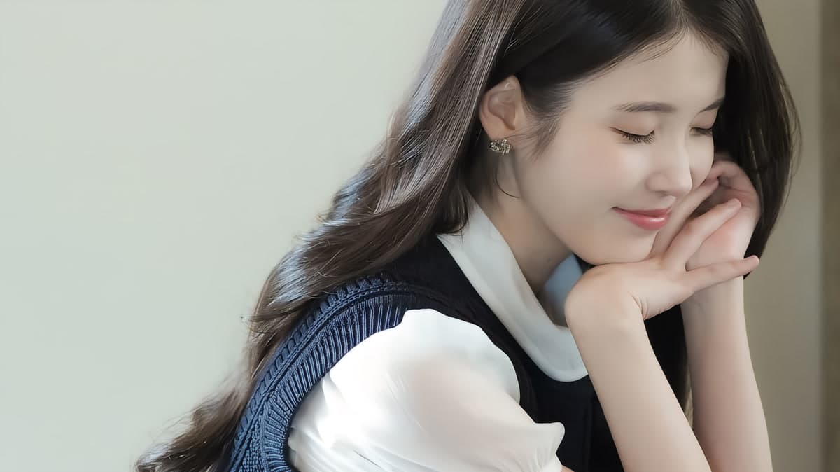 IU photographed at a press event in 2026