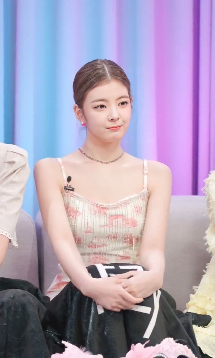 ITZY's Lia at a promotional event, known for her distinctive style and warm personality