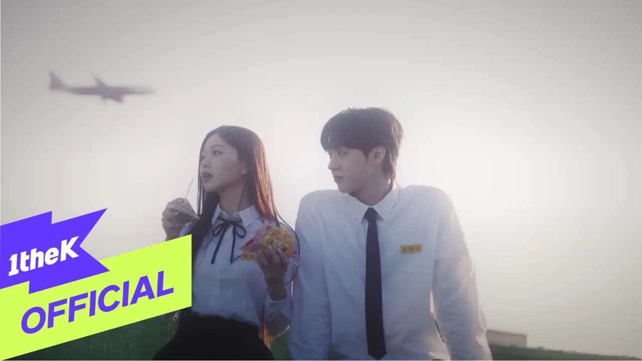 Gavy NJ's 5th-generation lineup in a still from the 'He Broke Up (이별했대)' music video, released via 1theK on May 4, 2026