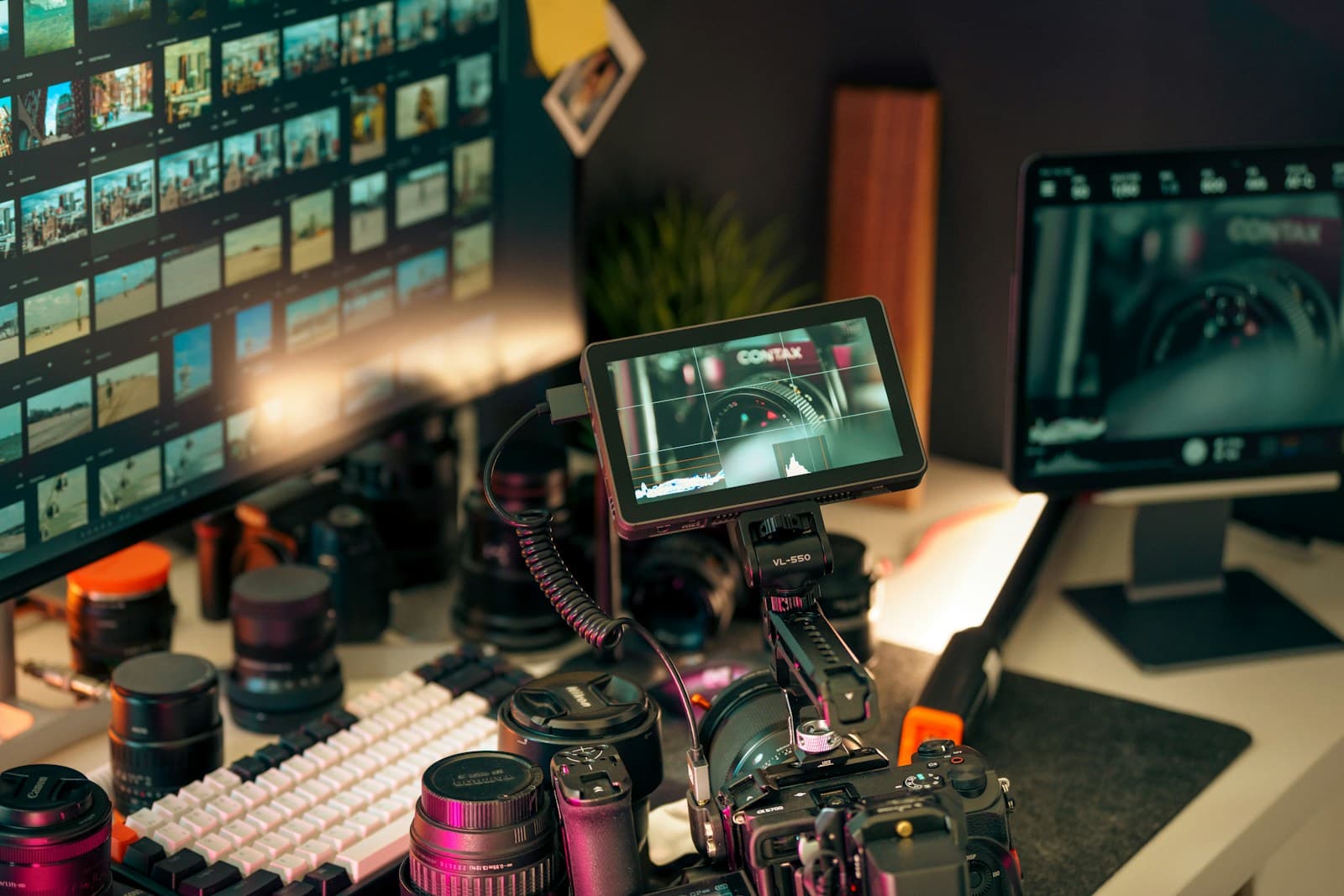 A production workstation with monitors and camera gear, representing Korean drama planning and Studio S production strategy.