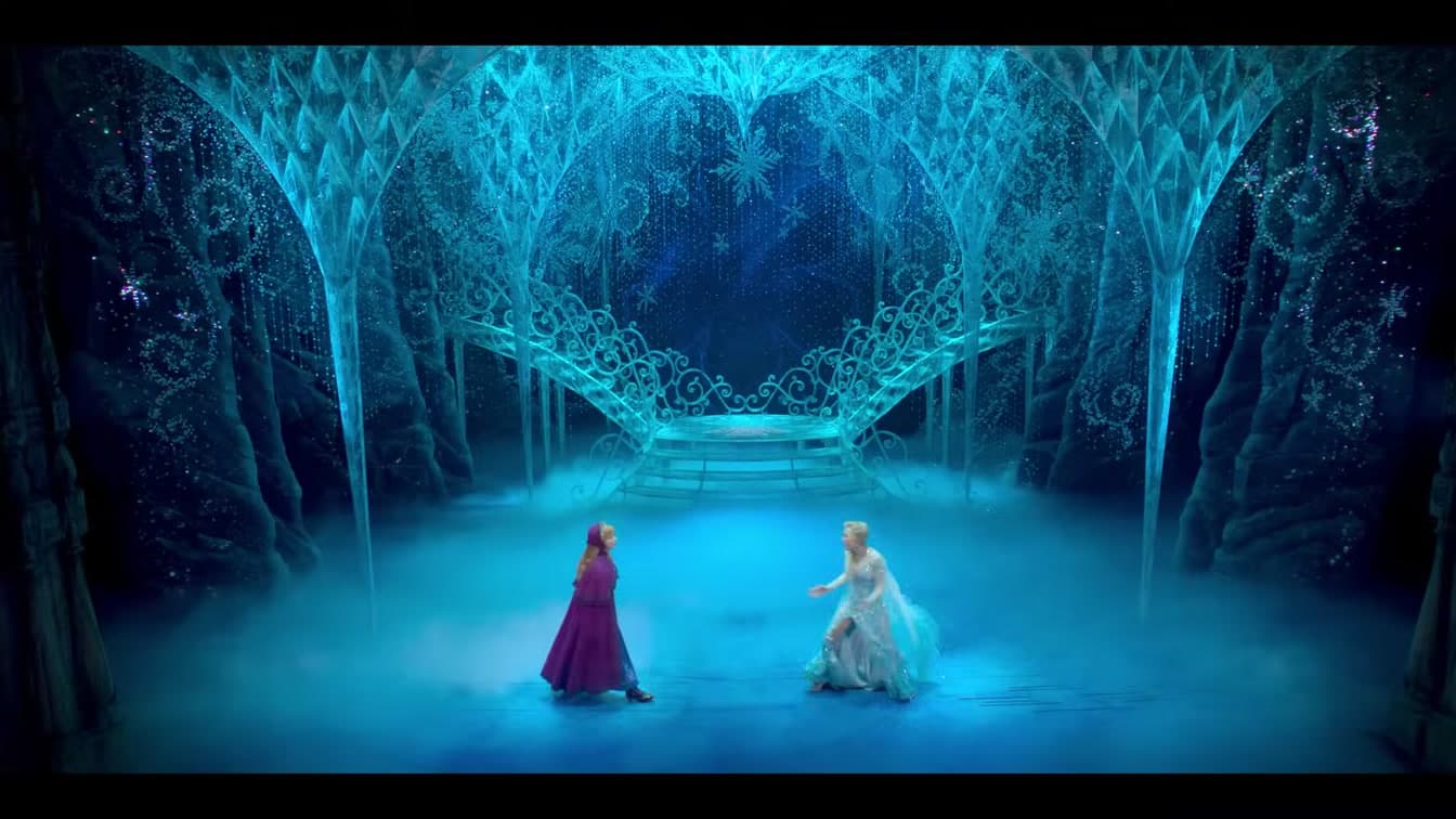 Elsa and Anna face each other in an iconic moment from Frozen the Musical's Broadway production — YouTube: Official Trailer