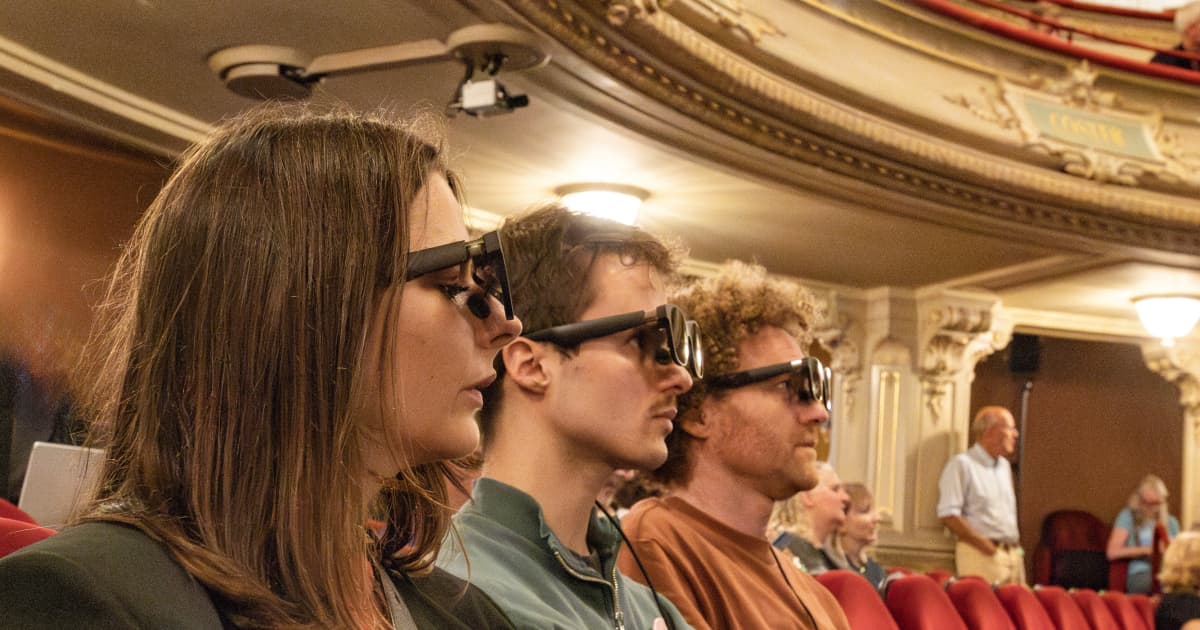 Smart subtitle glasses in use at a live theater performance. Photo: Stories of Purpose The Hague