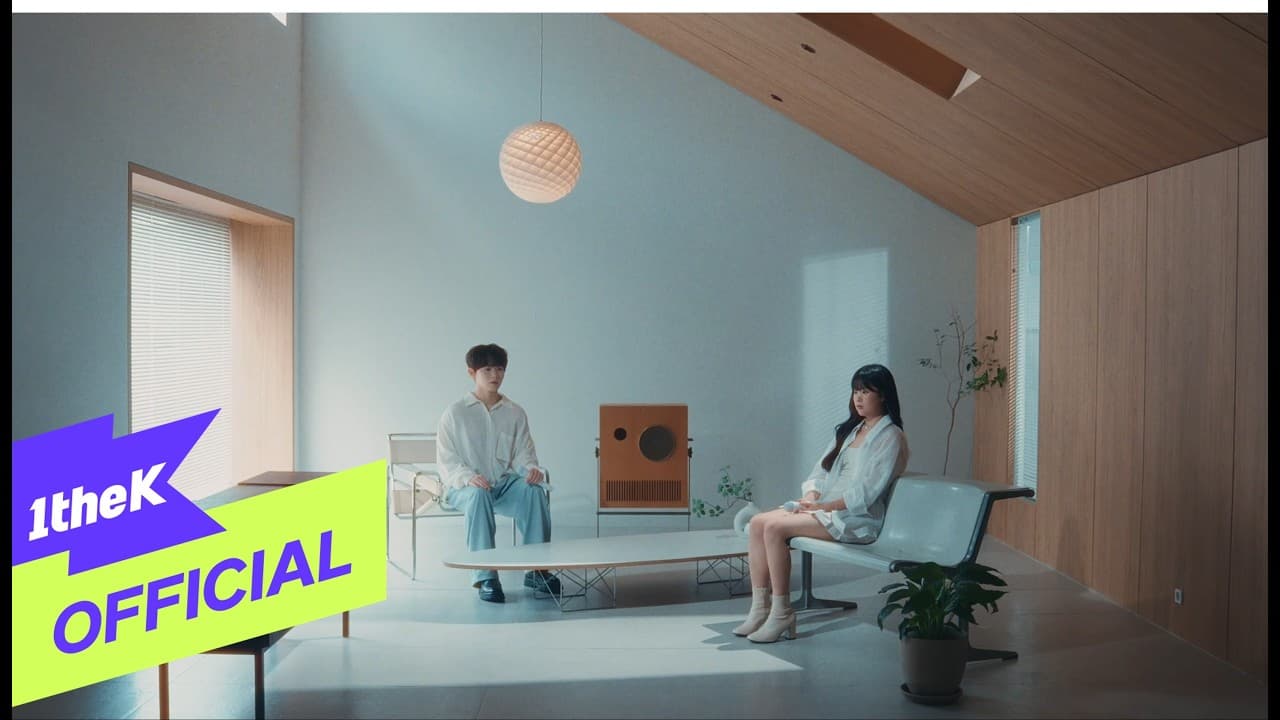 Lee Byeong Chan and Lee Ji Min in the official It’s Strange, With You MV thumbnail on 1theK.