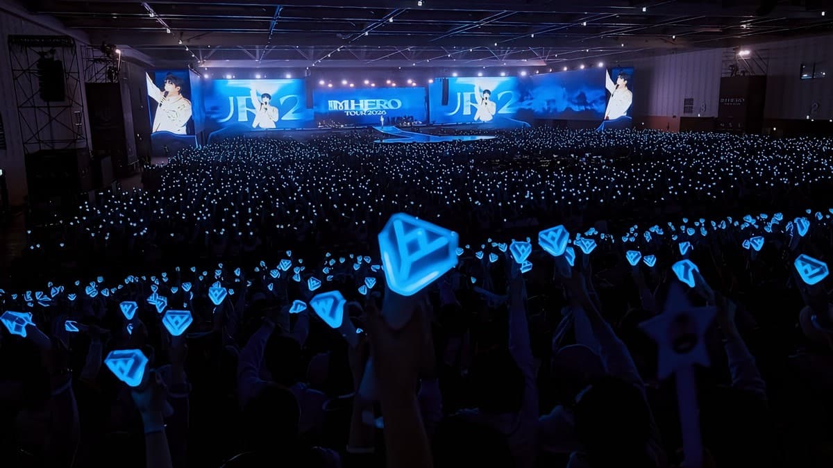 Lim Young-woong performing at his IM HERO TOUR 2026 concert, with fans holding glowing light sticks