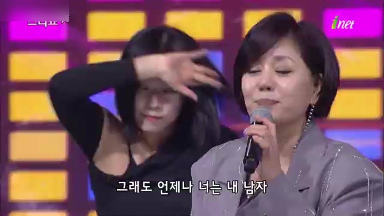 Han Hye-jin in a performance frame used as article cover imagery. Source: YouTube frame capture.