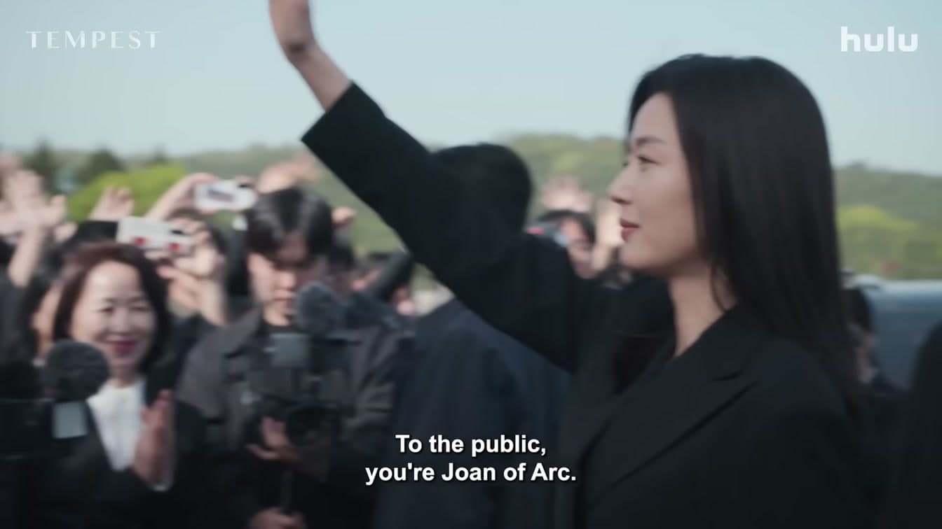 Jun Ji-hyun waves to a crowd in a scene from the Disney+ drama 'Tempest' — YouTube: Official Trailer