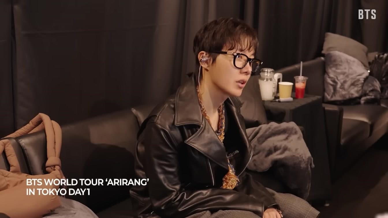 A BTS member relaxes backstage during the ARIRANG world tour stop in Tokyo — YouTube: BANGTANTV
